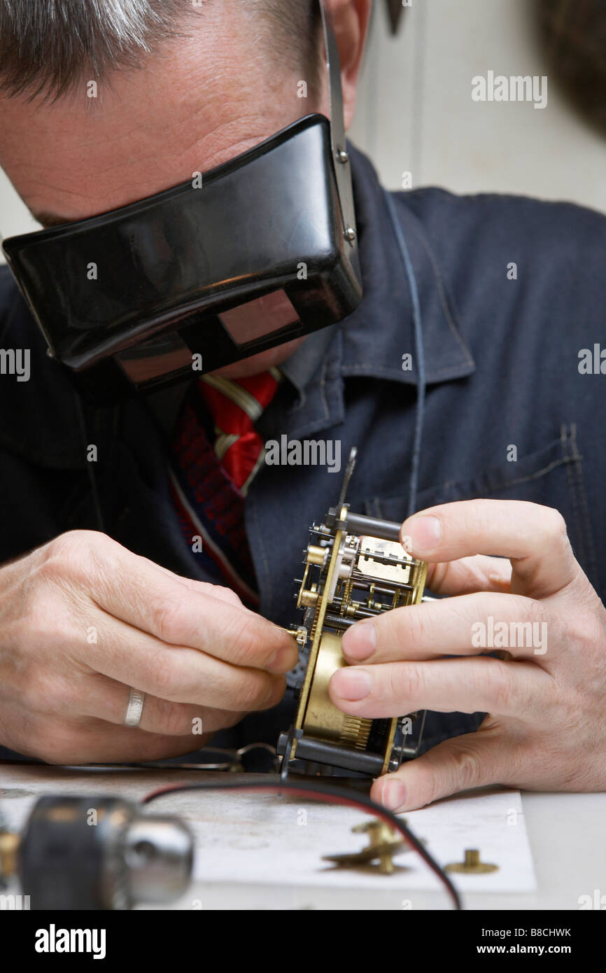Clock Repairman at Work Stock Photo Alamy