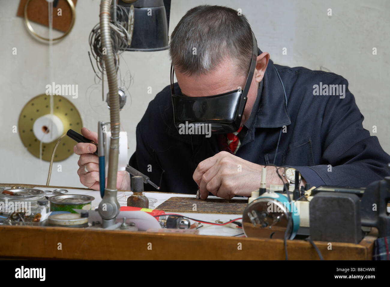 Clock Repairman at Work Stock Photo Alamy