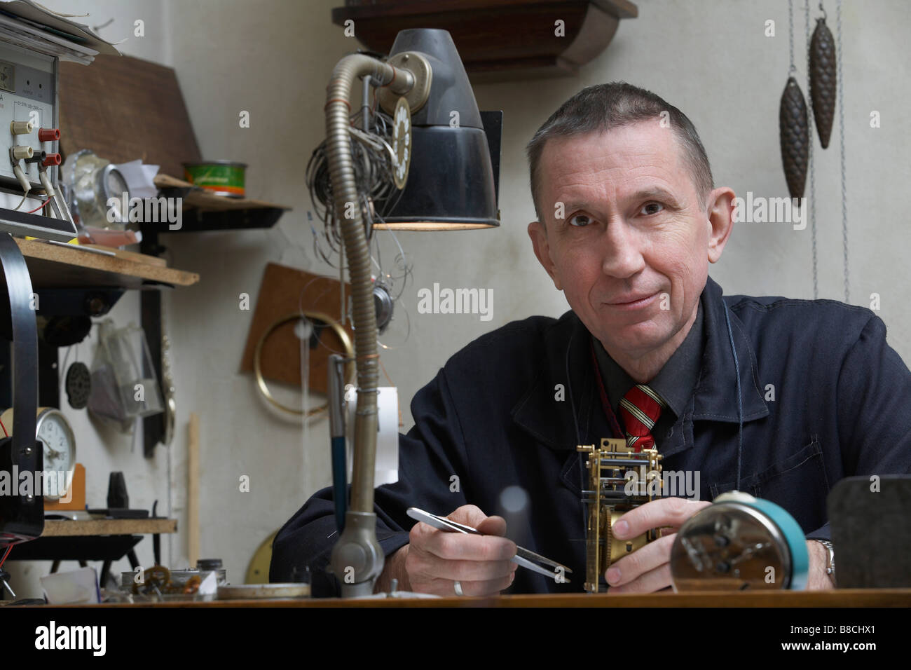 Clock Repairman at Work Stock Photo Alamy