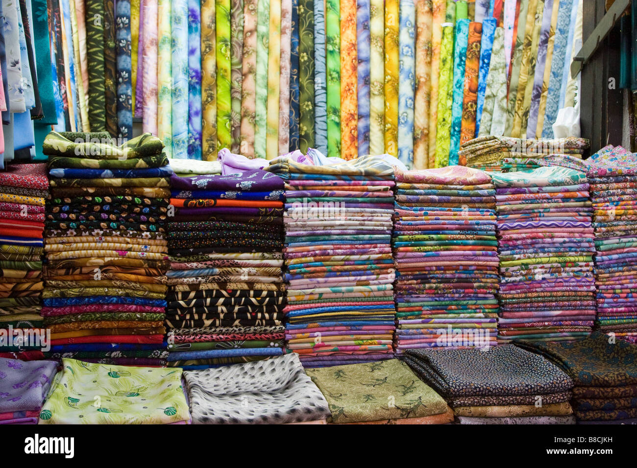 Dubai, UAE, Colorful fabrics are displayed for sale at the Al Naif souq in Deira. Stock Photo