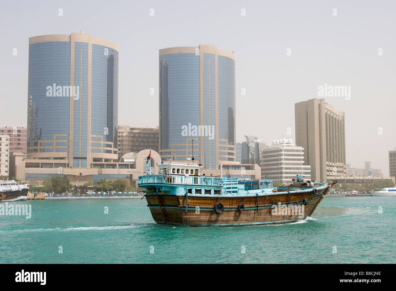 Dubai, UAE, A dhow, old wooden sailing vessel, cruises down Dubai Creek