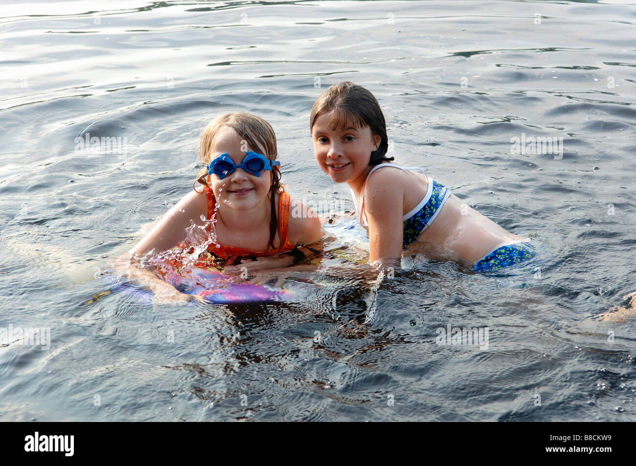 Girls, 8 years old, Swimming Lake Stock Photo - Alamy