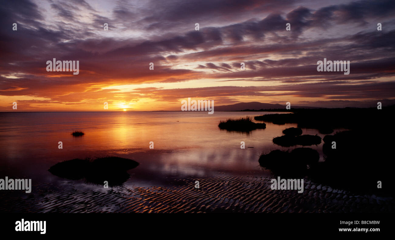 Sunset on the Solway Firth estuary from Powfoot near Annan on the Scottish coast Scotland UK Stock Photo