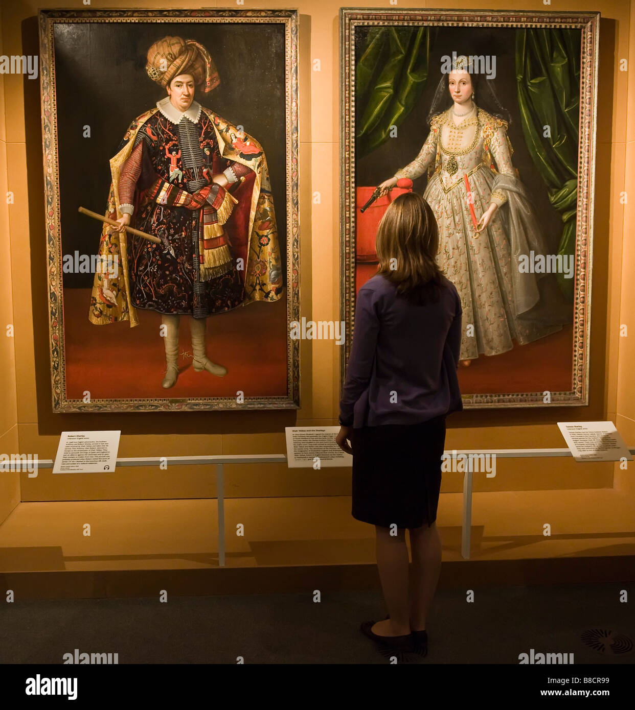 Woman admiring the Portraits of Robert and Teresia Sherley  at the Shah 'Abbas exhibition at British Museum London Stock Photo