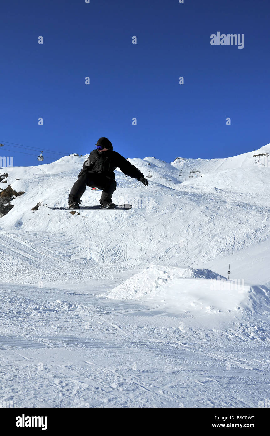 snoboarder jumping Stock Photo