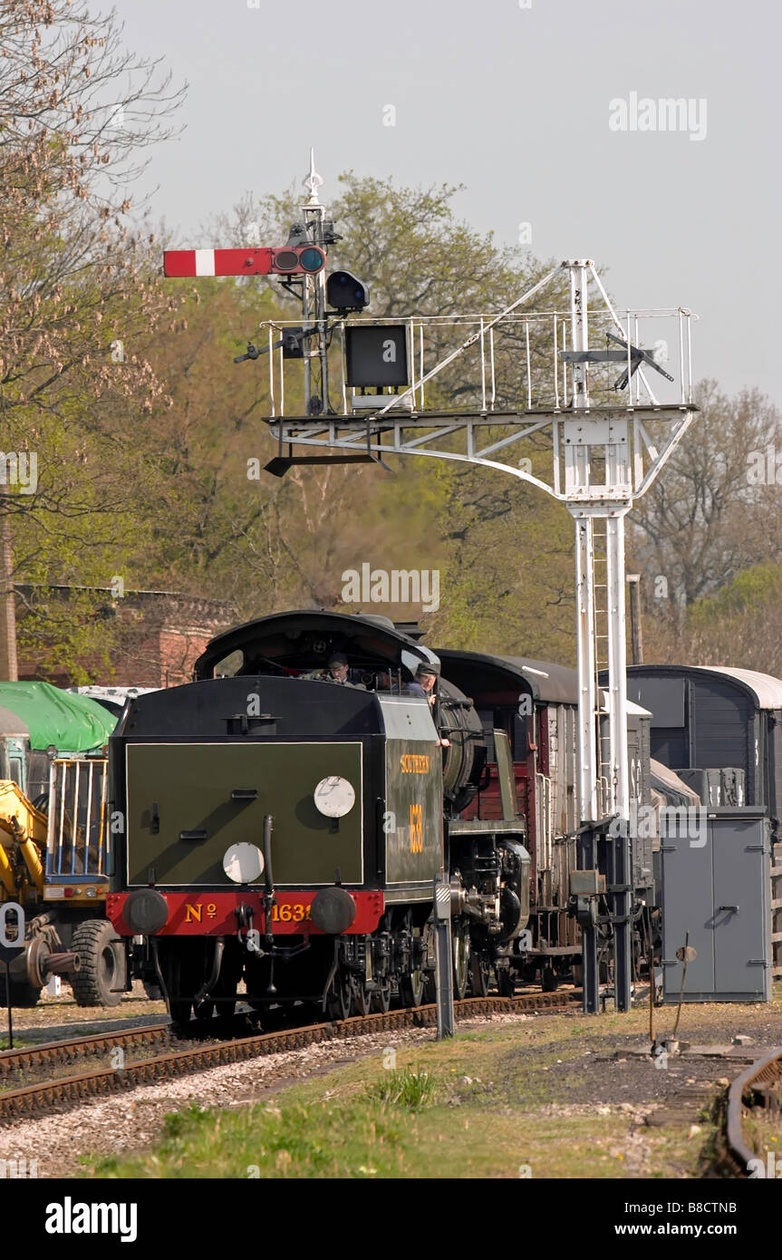 Southern railways livery steam engine pulling freight on the Bluebell Railway Stock Photo
