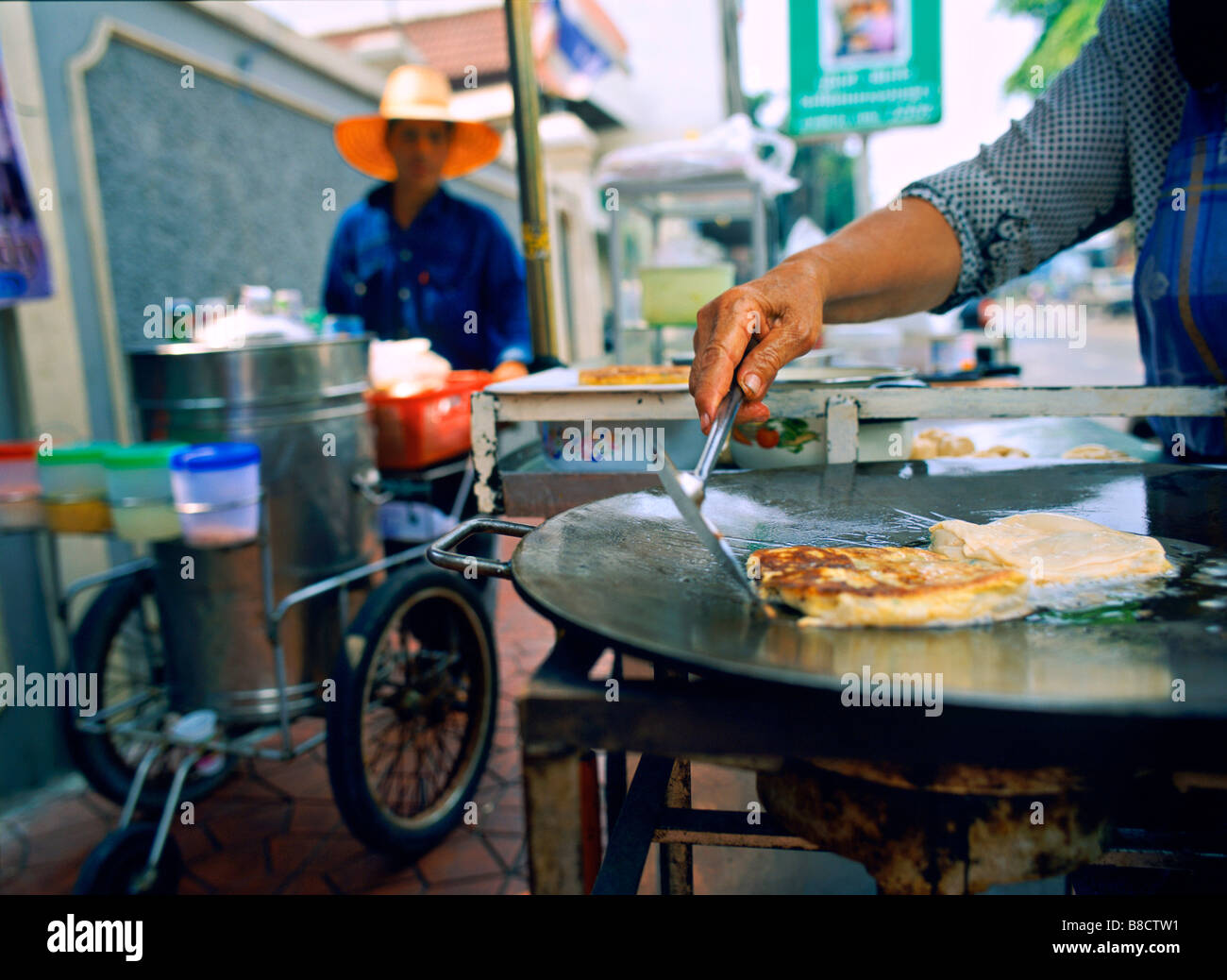 Muslim Woman makes Roti  Street Stall, Banglampu, Bangkok, Thailand Stock Photo