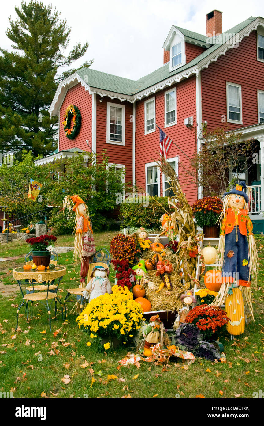 Autumn Yard Decor With Pumpkins Corn Stalks And Scarecrows At The