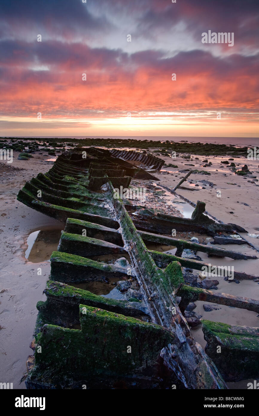 The shipwreck of the hull of the Sheraton captured at sunset on the North Norfolk coast at Old Hunstanton. Stock Photo