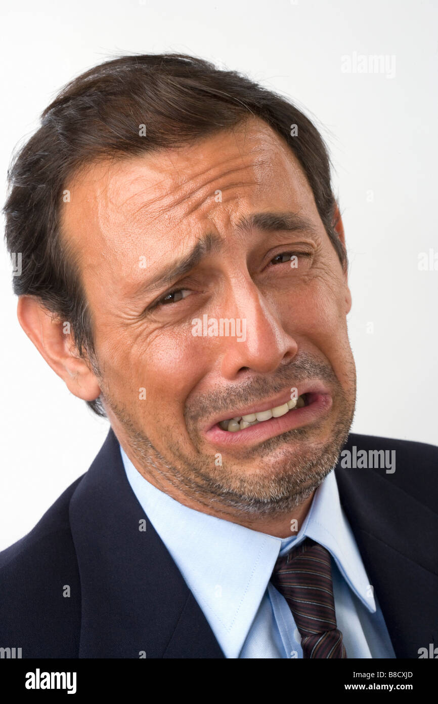 Close up of a man with a sad crying facial expression on white