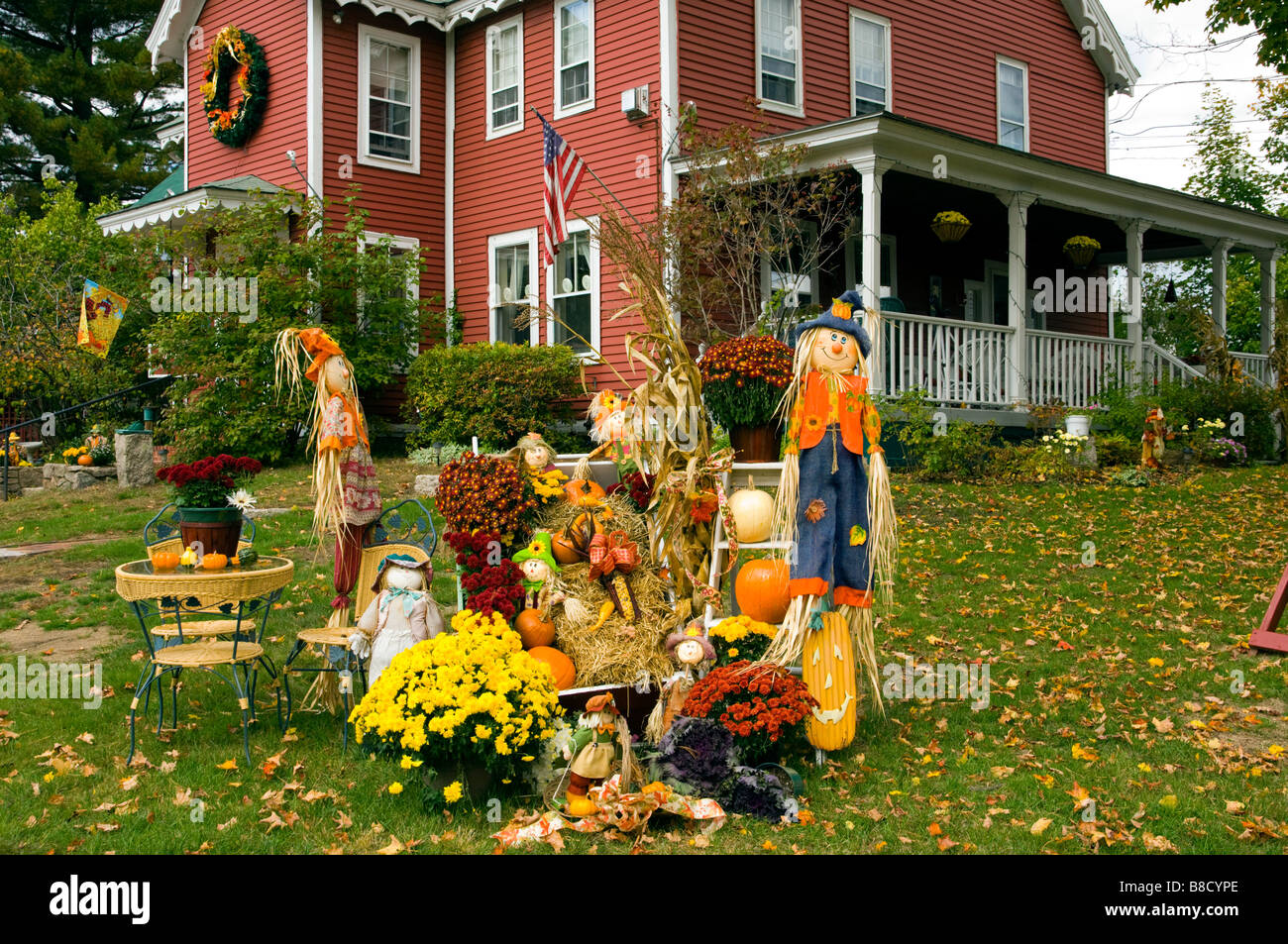 Autumn Yard Decor With Pumpkins Corn Stalks And Scarecrows At The