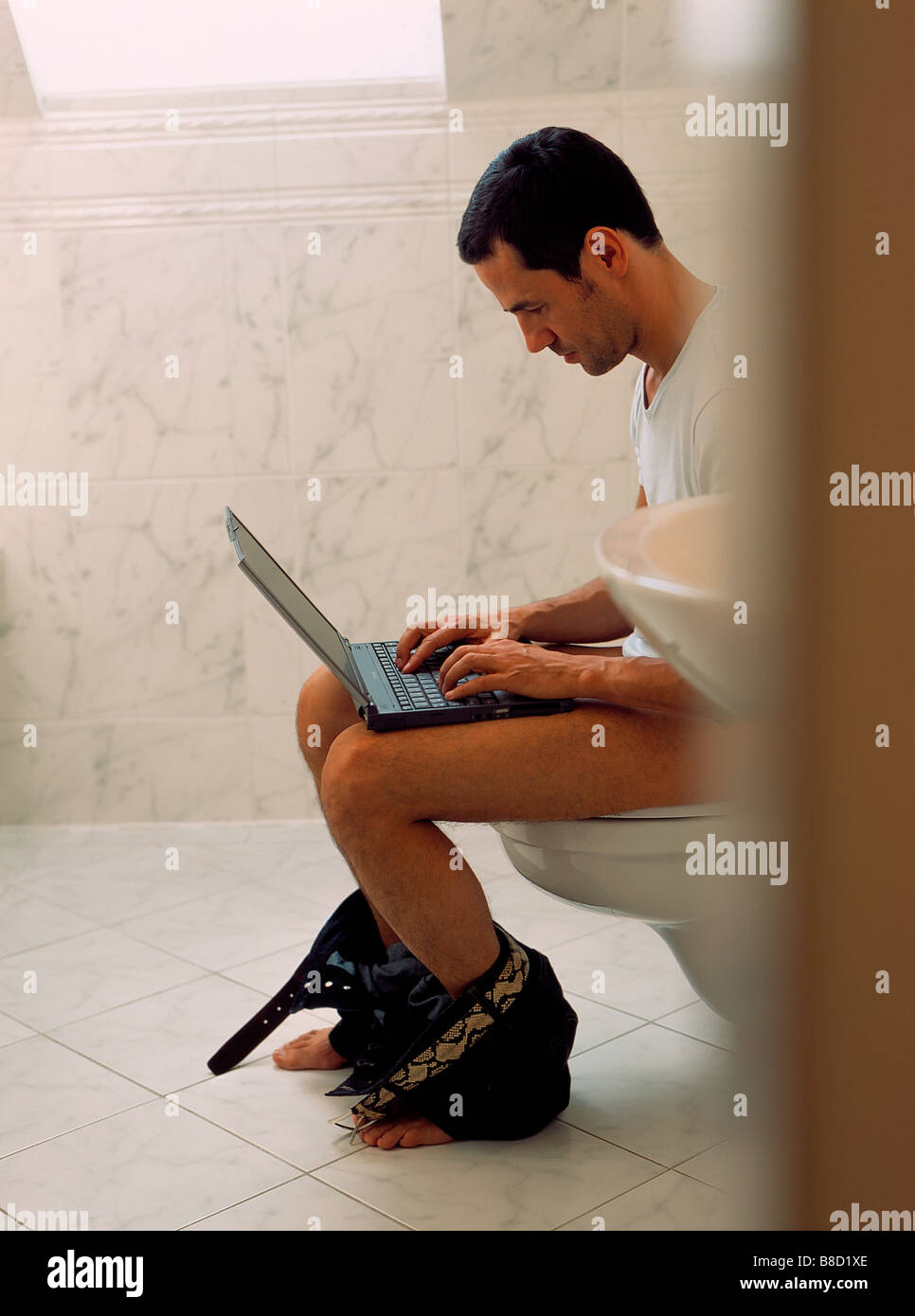 FV3012, Malek Chamoun; Man Bathroom looks down  Laptop Stock Photo
