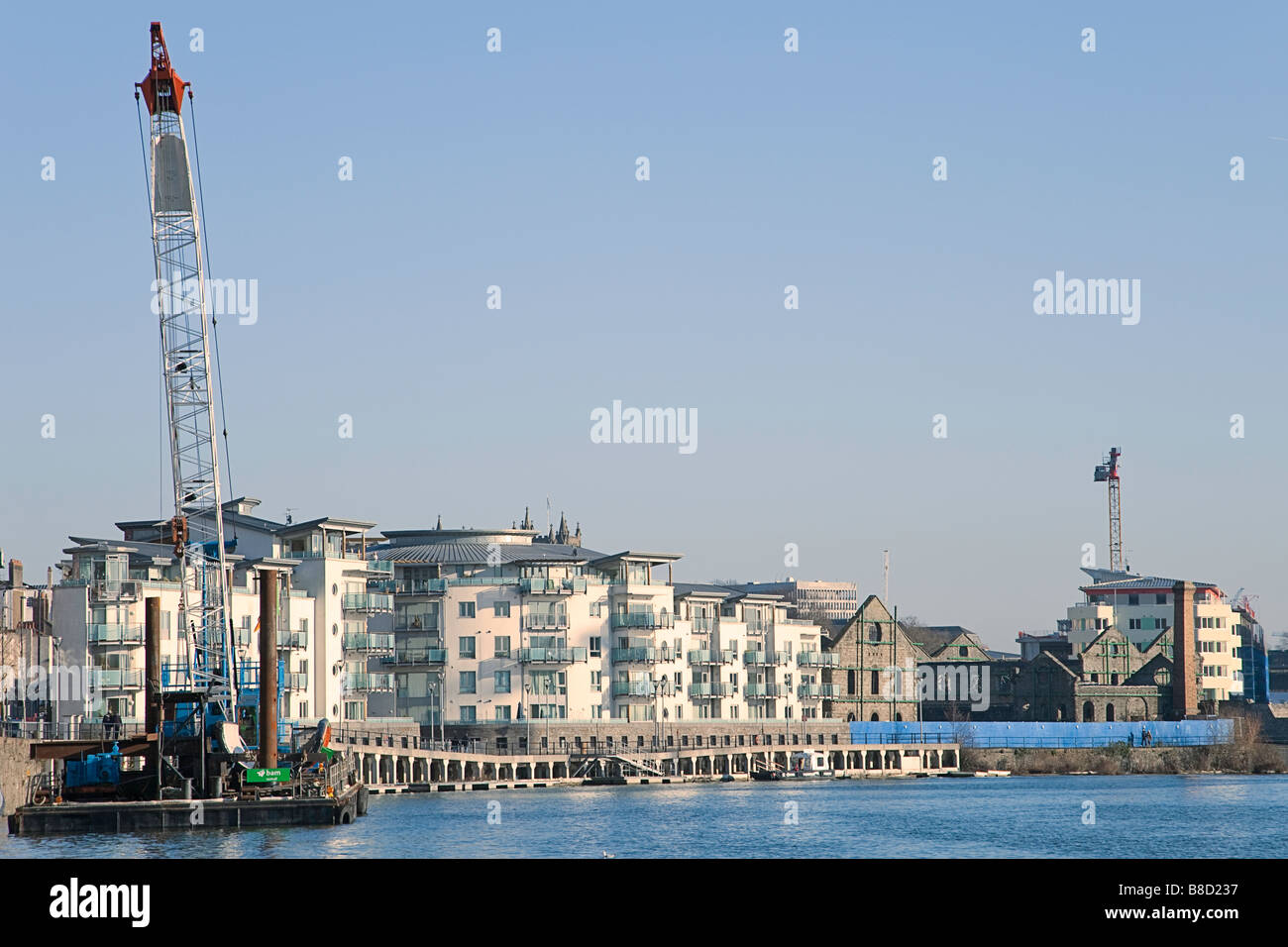 Bristol Floating Harbour Lattice Boom Floating Crane With New Housing Development & Listed Building Behind Stock Photo