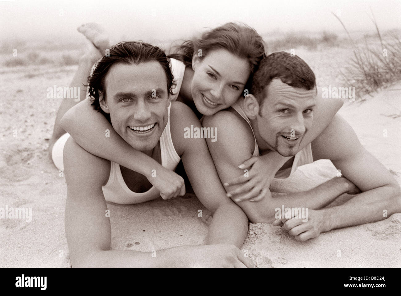 FV3046, Malek Chamoun; BW 3 Friends Embrace Beach Stock Photo