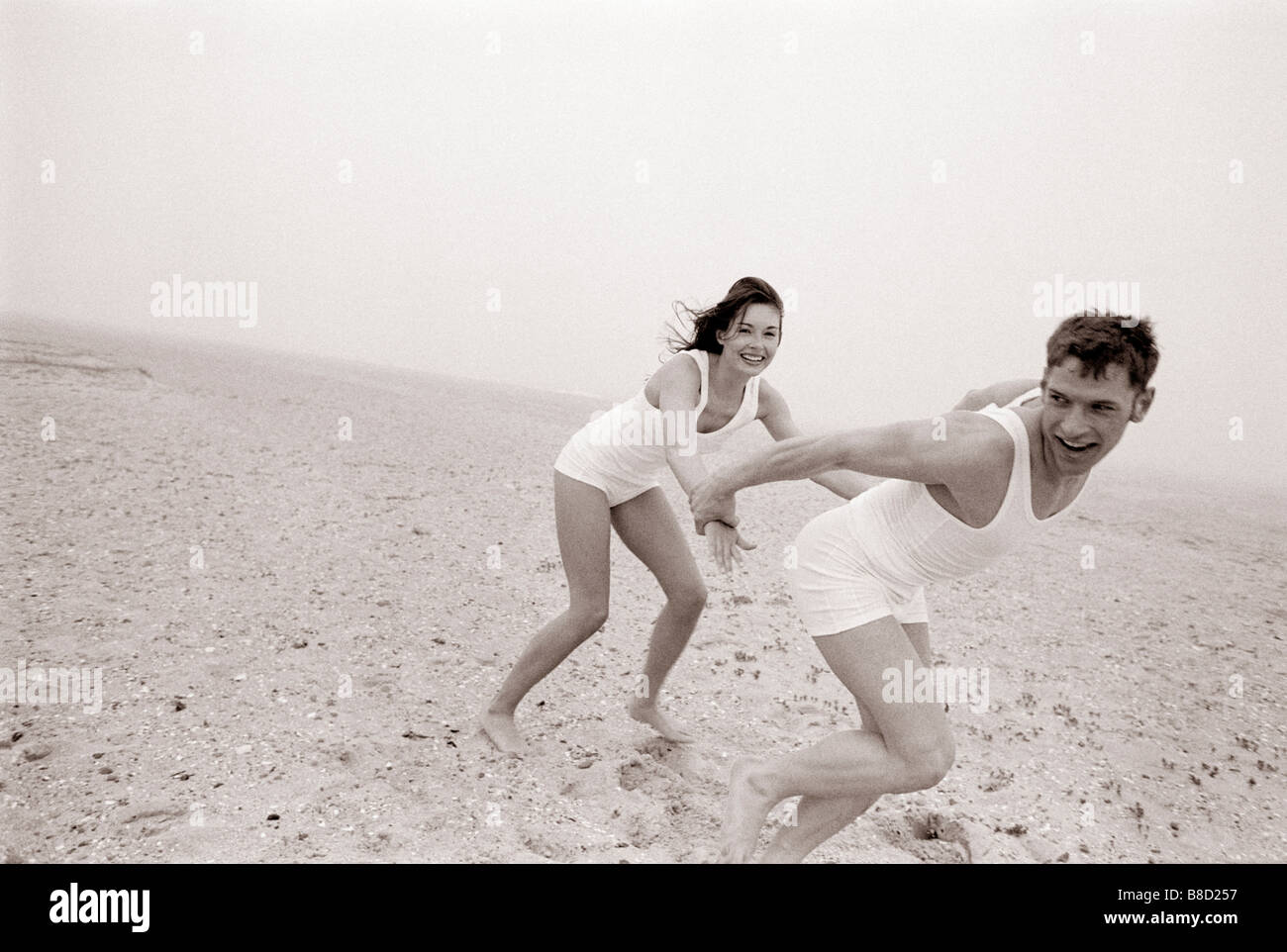 FV3049, Malek Chamoun; BW Couple Playing  Beach Stock Photo