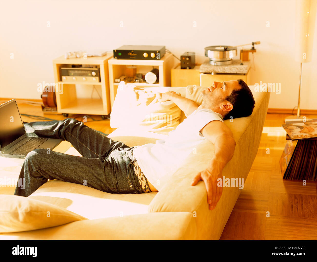 FV3060, Malek Chamoun; Young Man Relaxing Sofa Stock Photo
