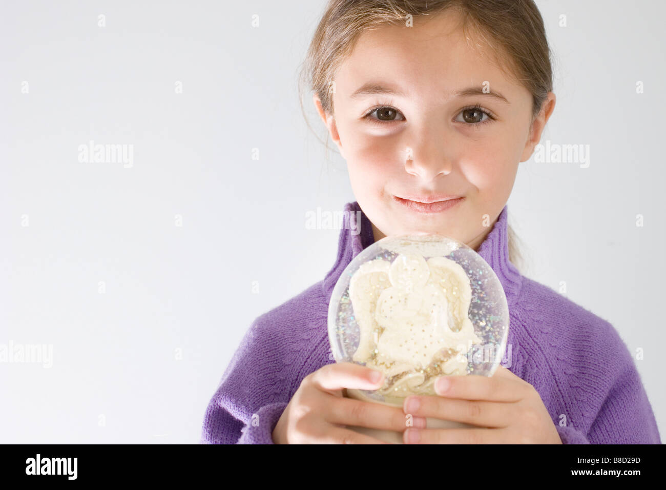 Young Girl holding Snow Globe Stock Photo Alamy
