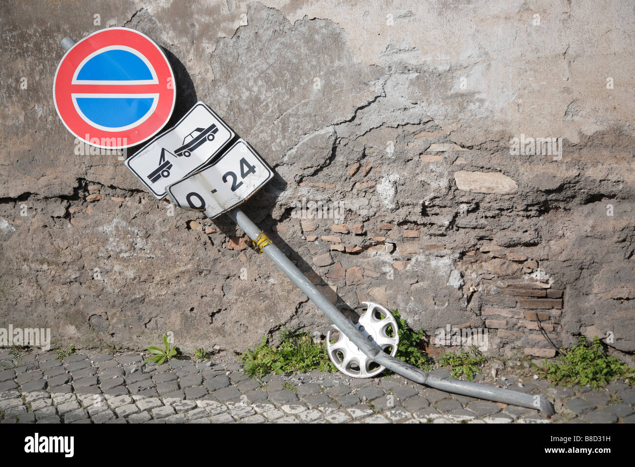 Road sign crashed by a car, Rome, Italy Stock Photo