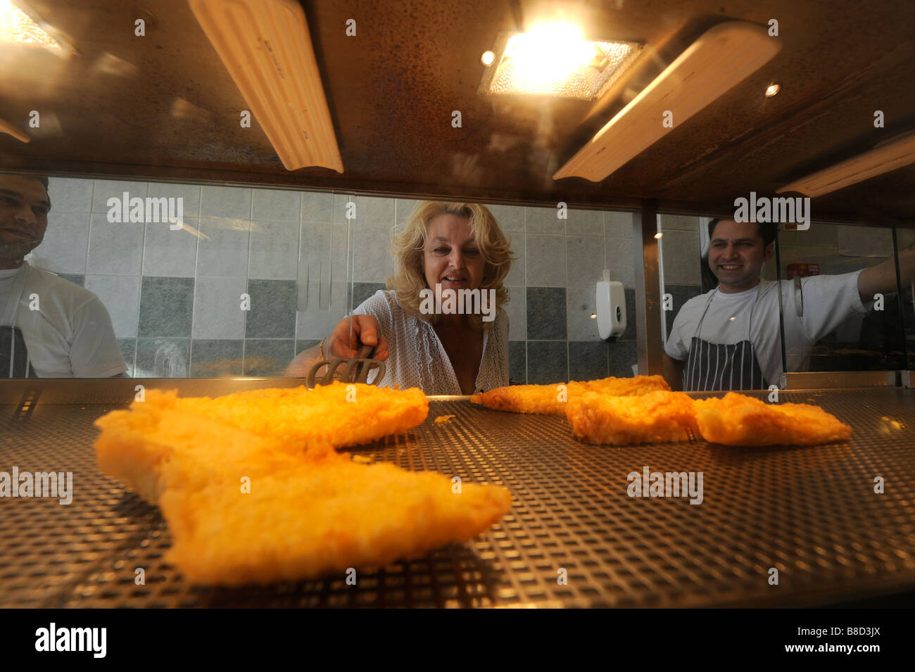 Battered fish being served up at the Chip Basket fish and chip cafe in