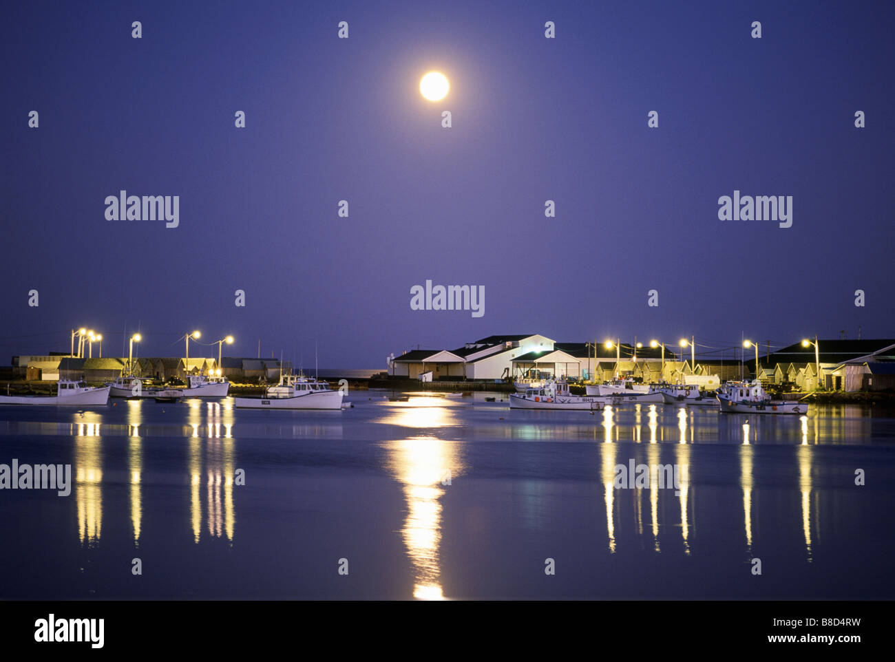 Moonrise over Fishing Boats, Graham Pond, Prince Edward Island Stock Photo