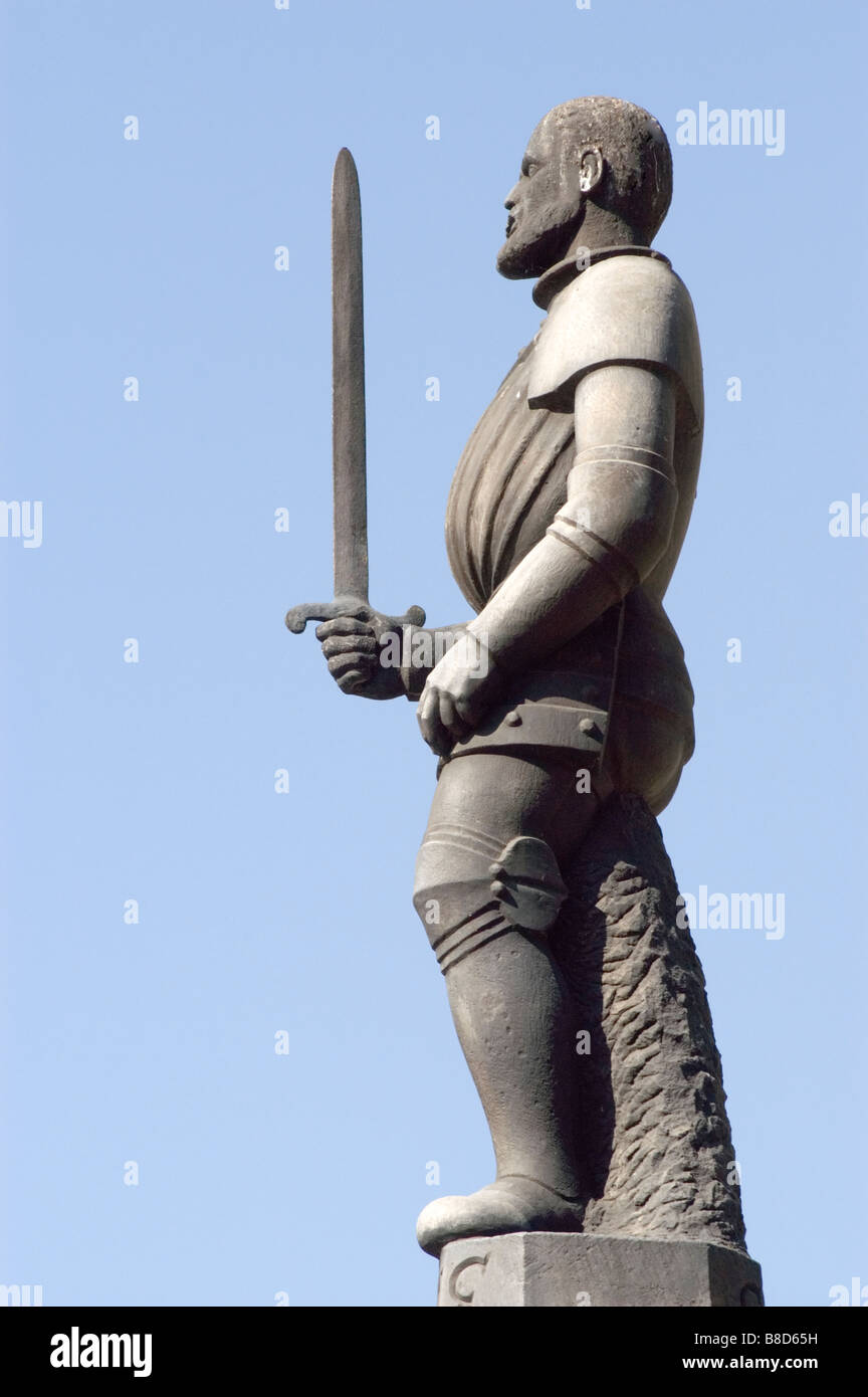 Man with sword statue on whipping post, pillory, Old Market Square, Poznan, Poland Stock Photo