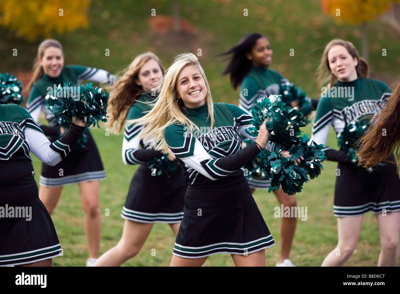 High school cheerleaders in uniform practice at their private school