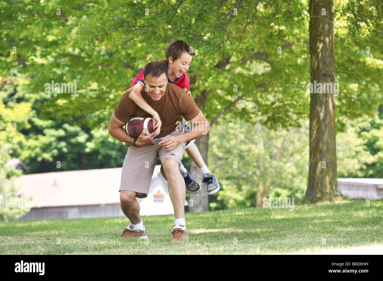 Father Son Playing Football Park Stock Photo - Alamy