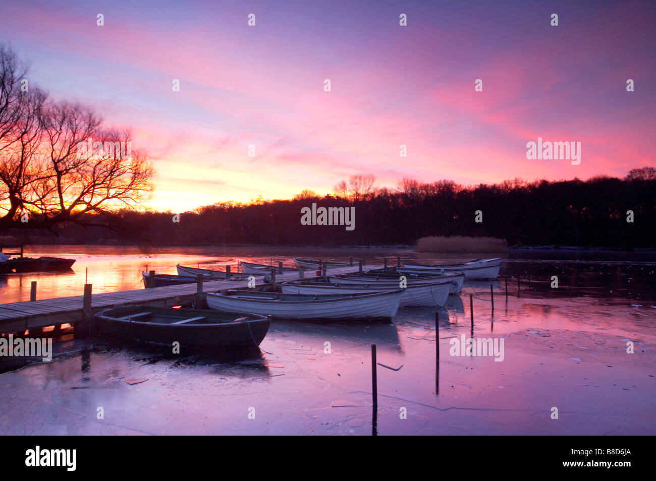A winter sunrise over a frozen Ormesby Broad on the Norfolk & Suffolk