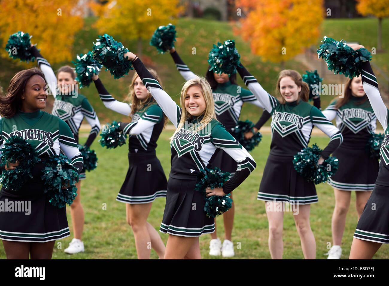High school cheerleaders in uniform practice at their private school