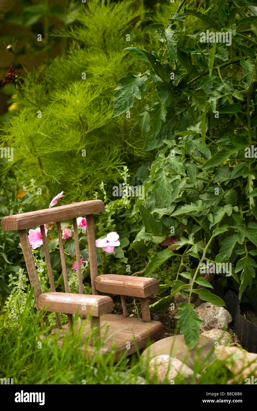 Little Chair Garden Stock Photo Alamy