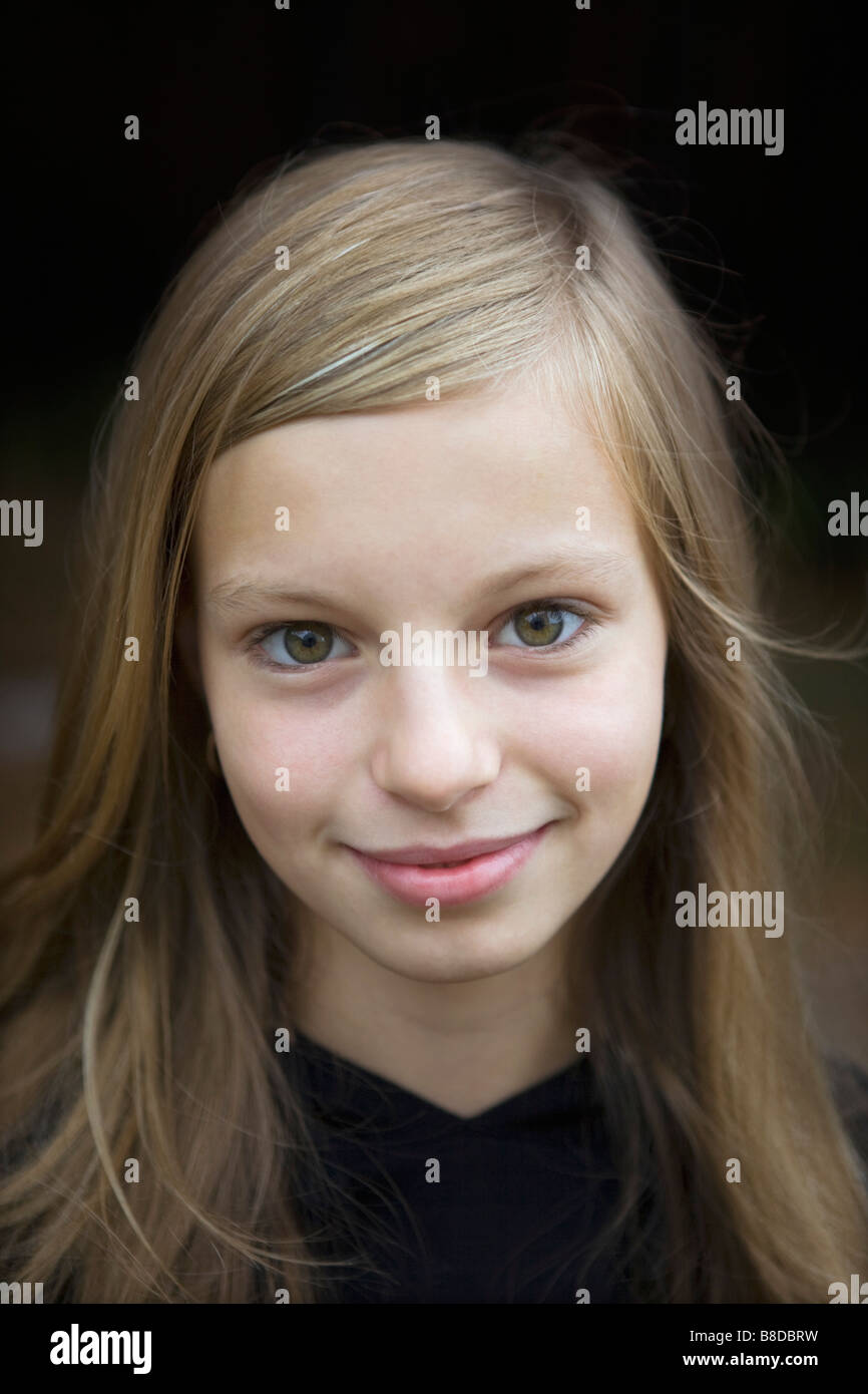 Studio portrait of girl smiling Stock Photo - Alamy