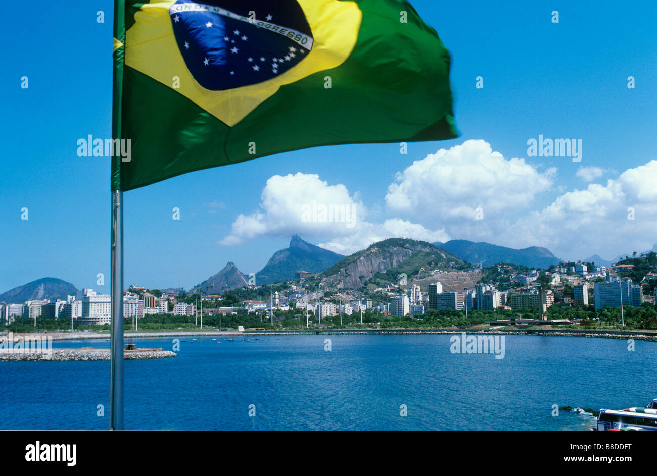 Rio de Janeiro, Brazil, under the national flag, famed for its Carnival, Corcovada Mountain Statue of Christ,Capital City Stock Photo