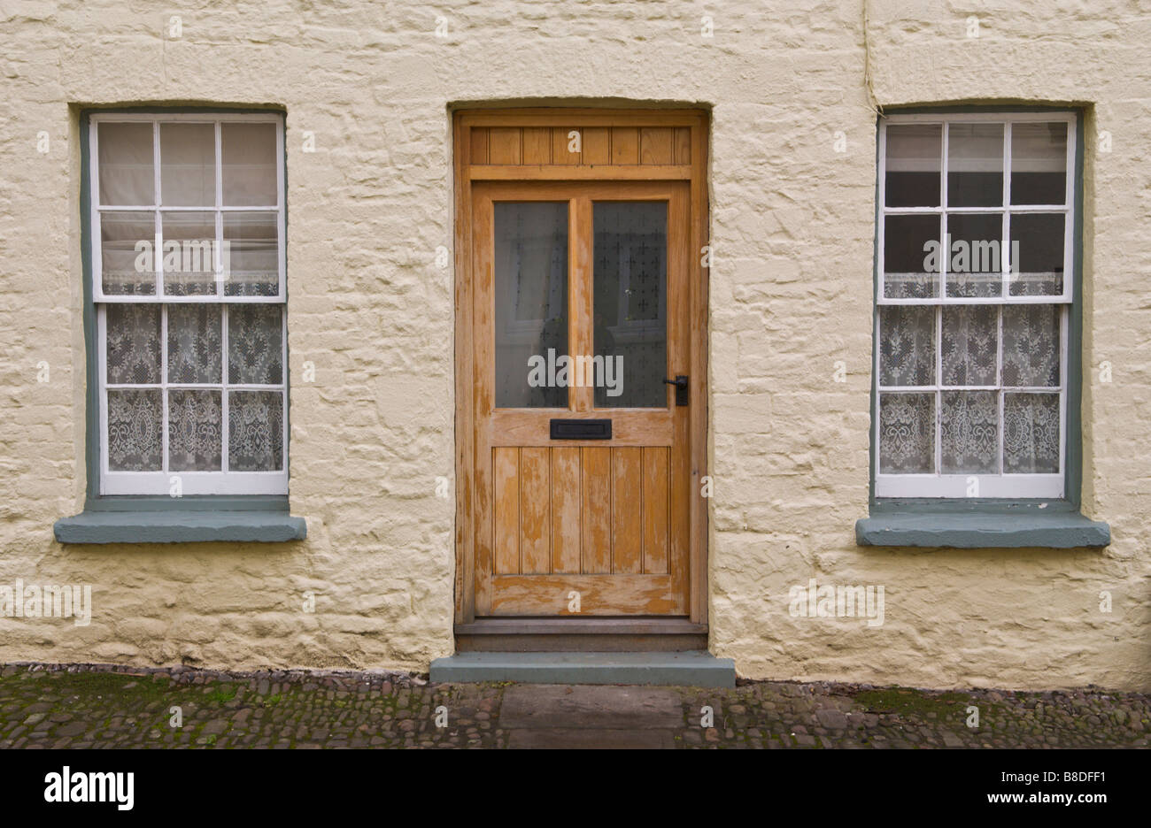 Front door of terraced house with sash windows in Crickhowell Powys