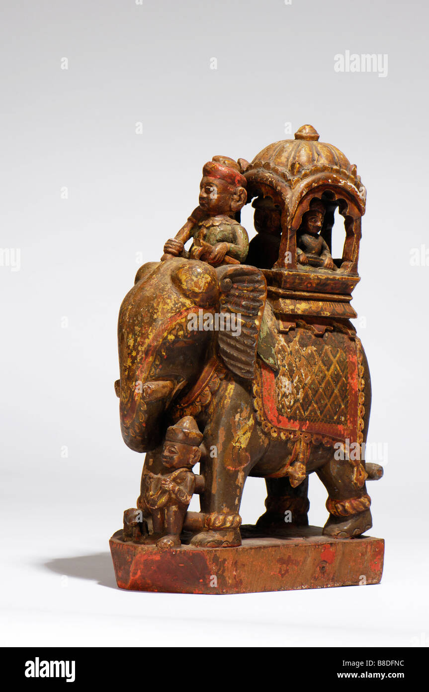 An Antique Indian carved wood and painted caparisoned elephant. Stock Photo