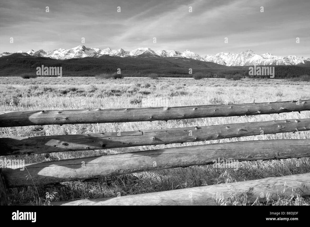 Fence and Field near Sawtooth Mountain Range off Highway 75 in Idaho North America United States Stock Photo