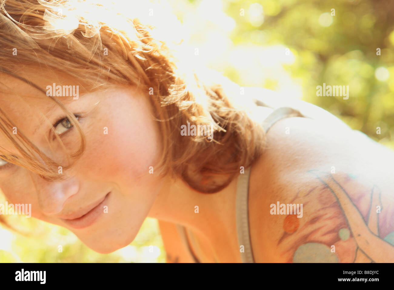 Smiling woman with tattoos, Riding Mountain National Park, Manitoba, Canada Stock Photo