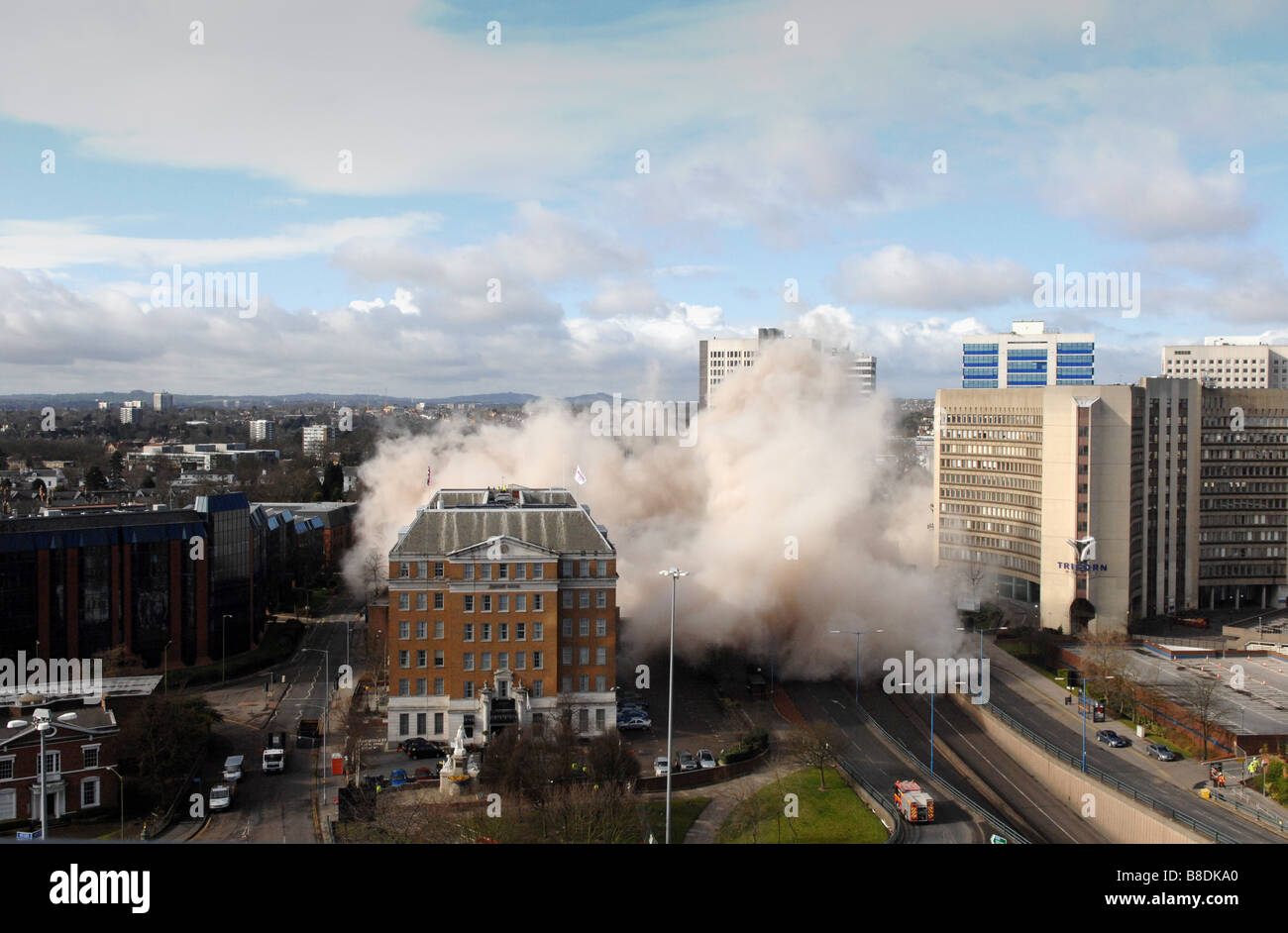 Dust cloud at Fiveways Birmingham after Edgbaston Shopping Centre is demolished by explosives Stock Photo