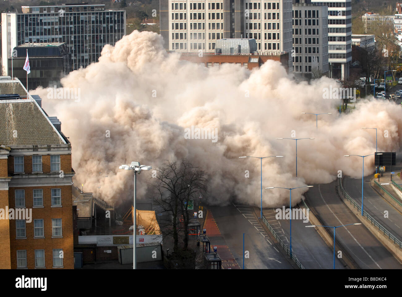 Dust cloud at Fiveways Birmingham after Edgbaston Shopping Centre is demolished by explosives uk Stock Photo