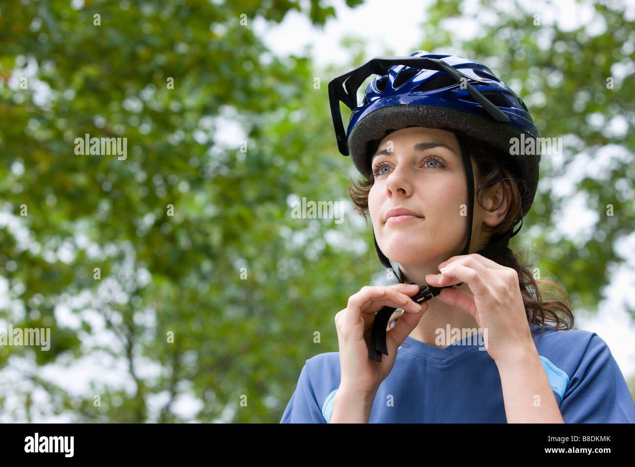 Woman wearing bicycle helmet Stock Photo Alamy
