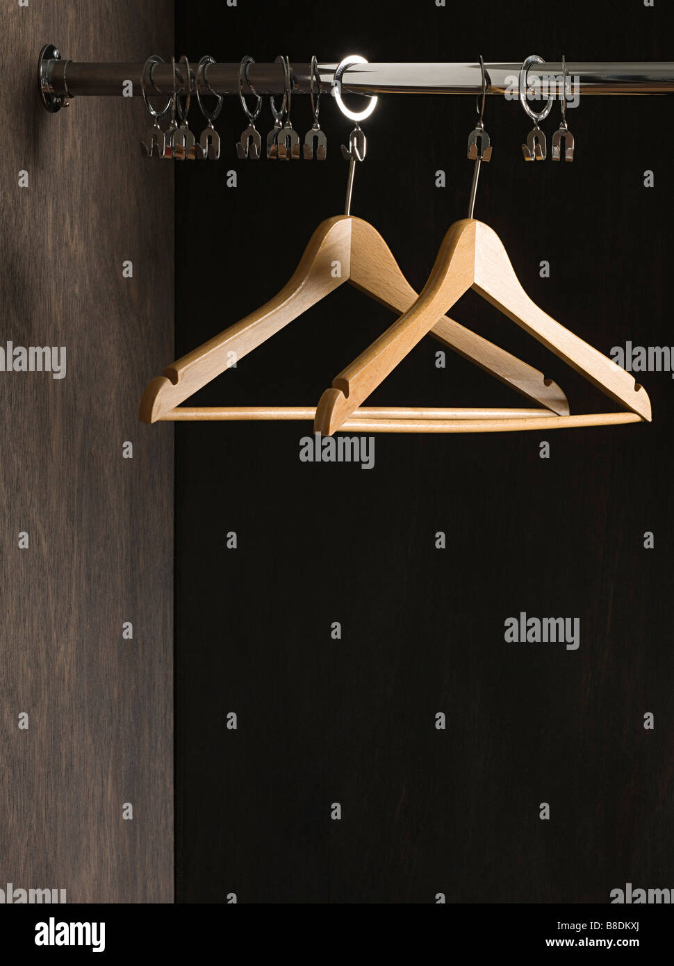 Clothes hangers in closet Stock Photo Alamy