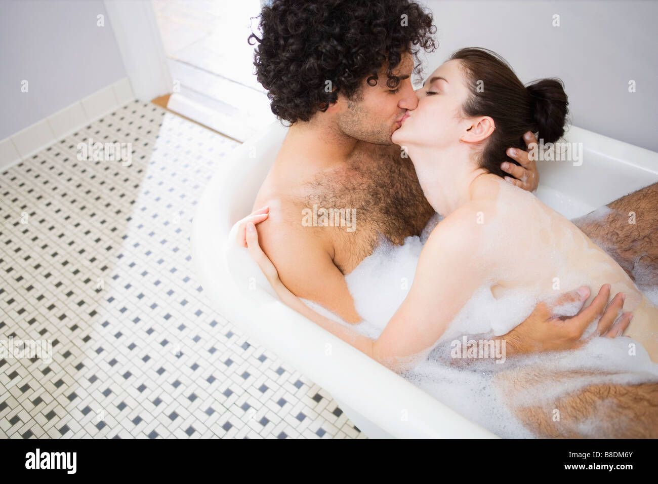 Couple kissing in the bath Stock Photo - Alamy