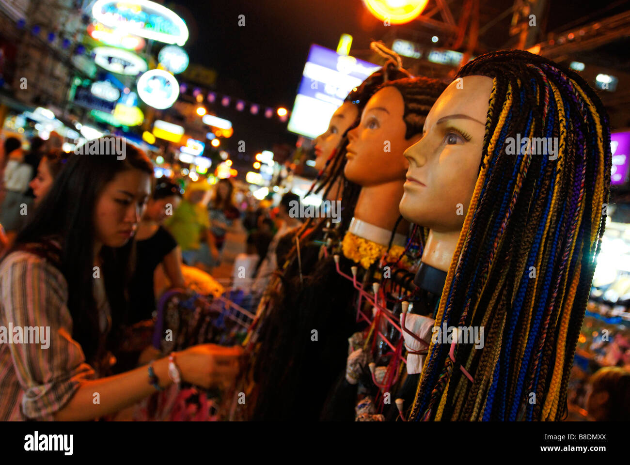Street stall offering dreadlocks to tourists along Khao San Road in Bangkok Thailand Stock Photo