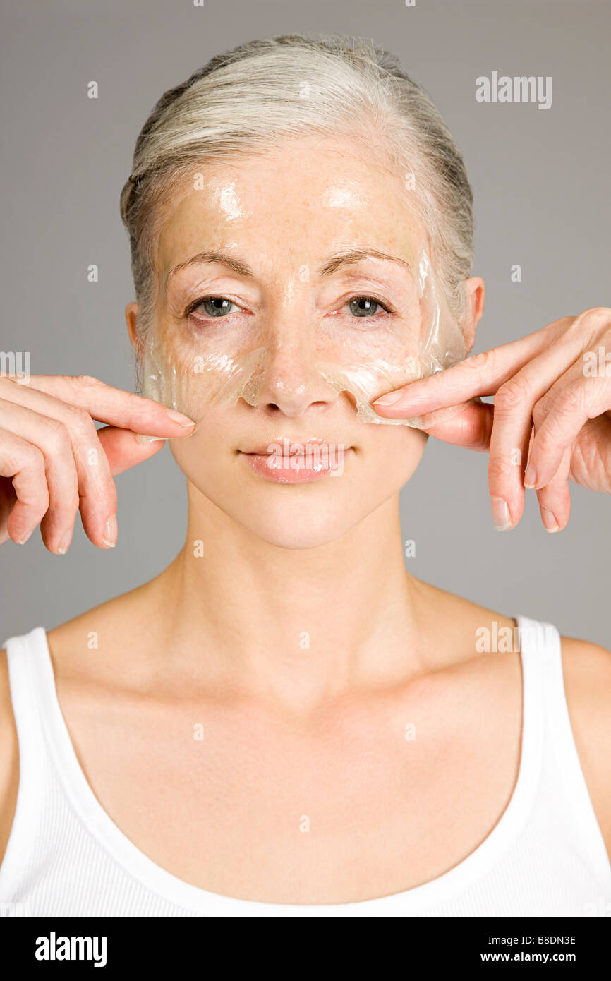Woman with antiaging face mask Stock Photo Alamy
