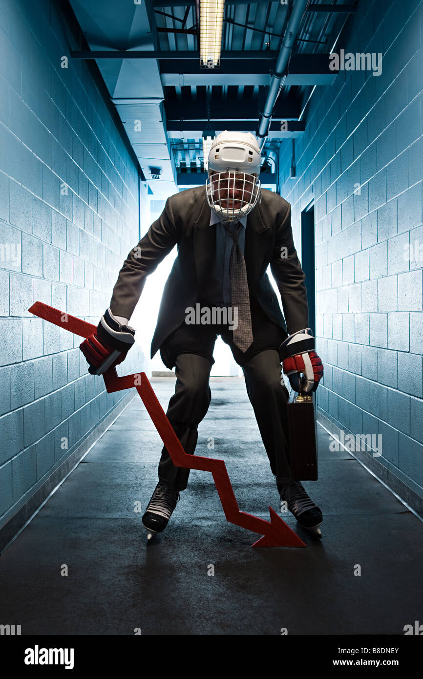 Businessman wearing an ice hockey uniform Stock Photo