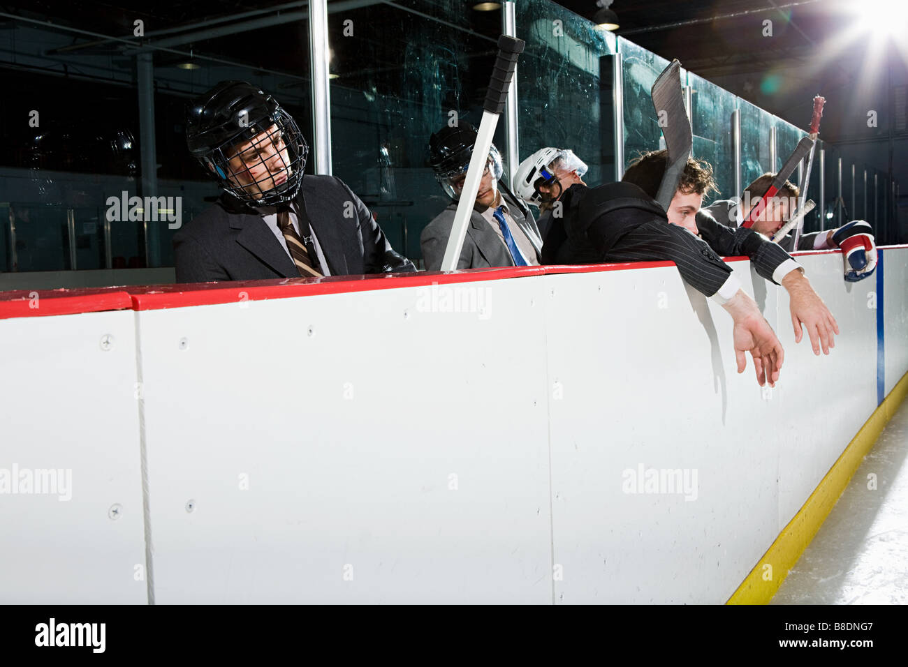Businessmen at the edge of an ice rink Stock Photo