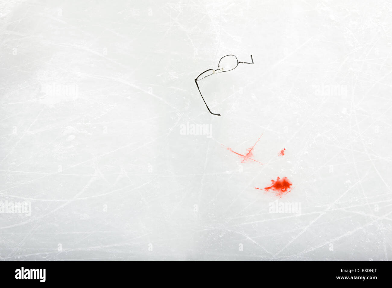 Eyeglasses and blood on the ice Stock Photo