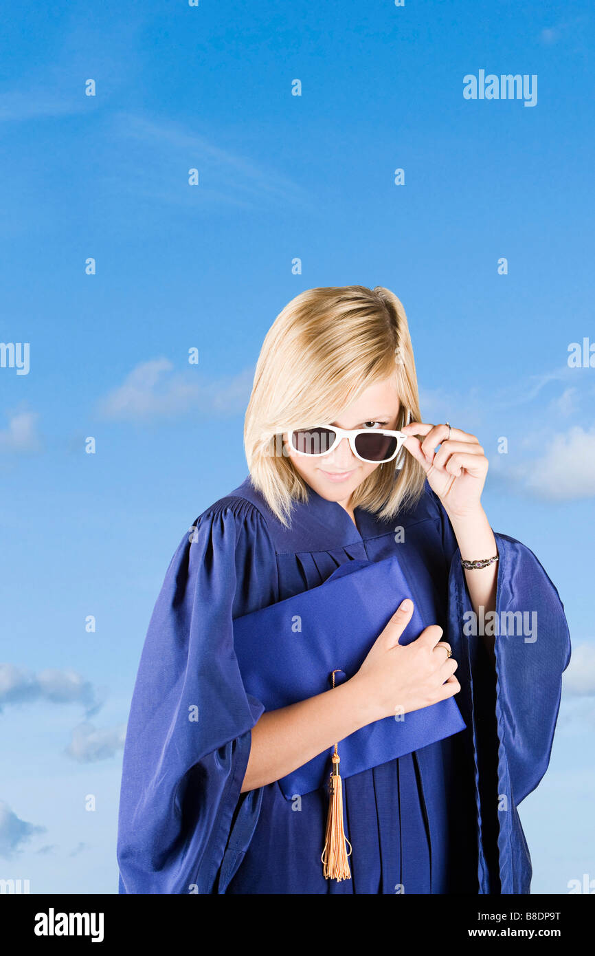 Graduating girl wearing sunglasses Stock Photo