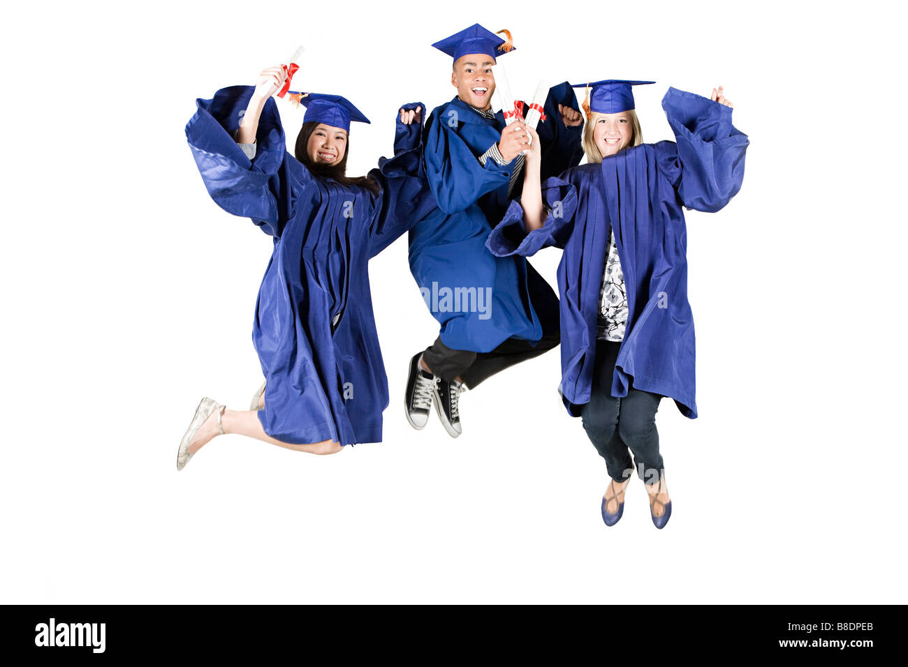 High school graduates jumping Stock Photo