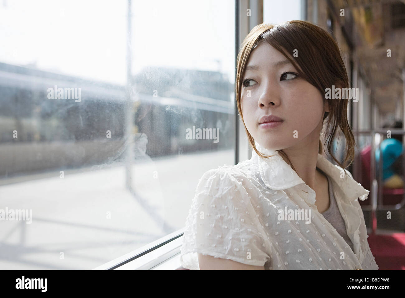 https://c8.alamy.com/comp/B8DPW8/young-woman-on-train-B8DPW8.jpg