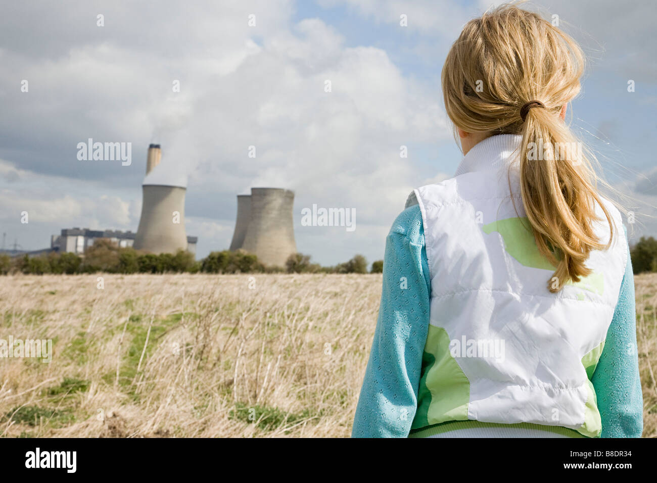 Girl by power station Stock Photo